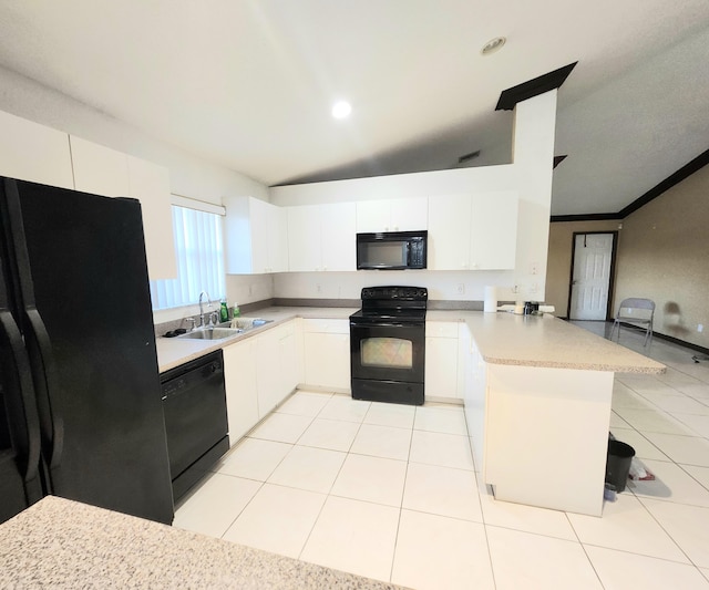 kitchen featuring black appliances, white cabinets, kitchen peninsula, and sink