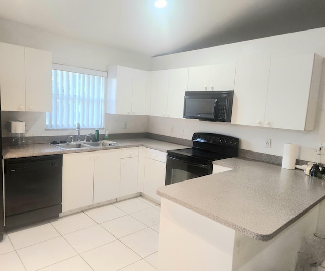 kitchen with white cabinetry, sink, and black appliances