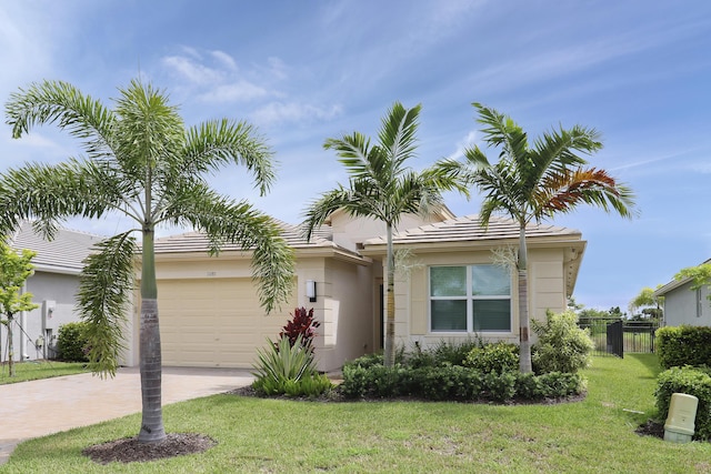 view of front of house featuring a garage and a front yard