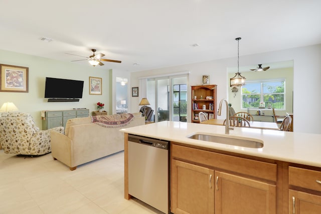 kitchen featuring pendant lighting, ceiling fan, dishwasher, and sink