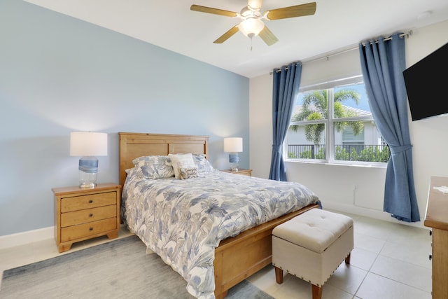 bedroom with light tile patterned floors and ceiling fan