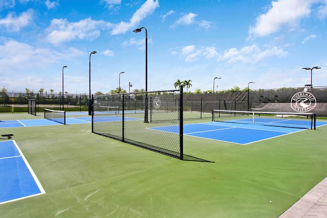 view of tennis court featuring basketball court