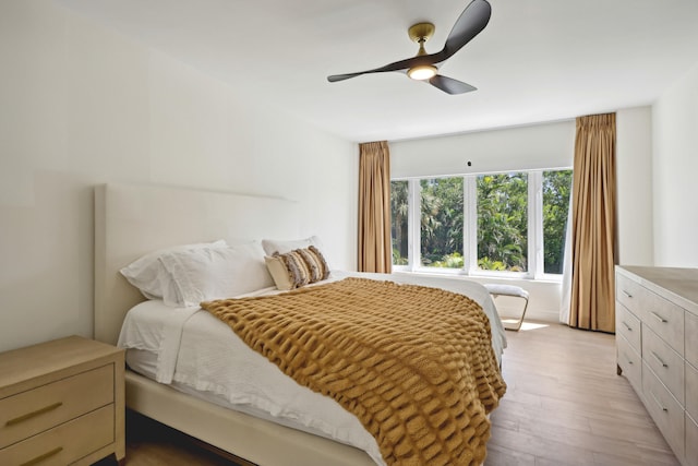 bedroom featuring light hardwood / wood-style flooring and ceiling fan