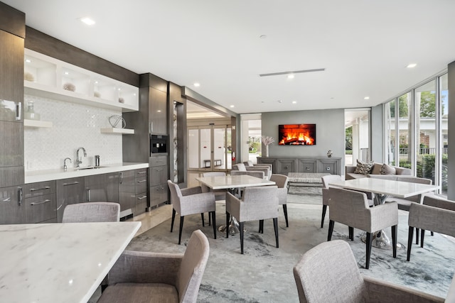 dining area featuring a healthy amount of sunlight and sink