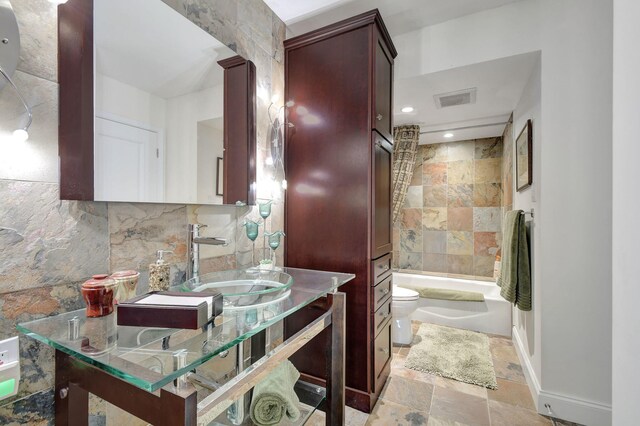 full bathroom featuring vanity, toilet, and shower / bathing tub combination