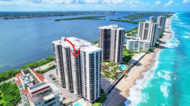 aerial view with a water view and a view of the beach