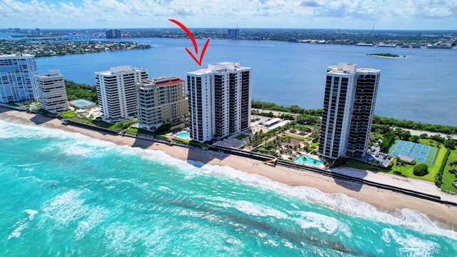 aerial view featuring a view of the beach and a water view