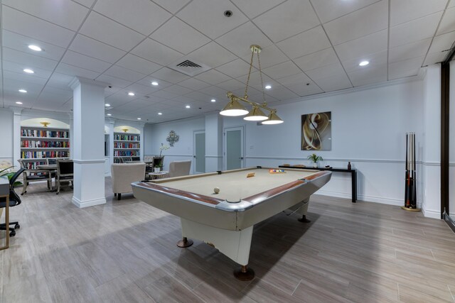 game room with ornamental molding, billiards, and light hardwood / wood-style floors