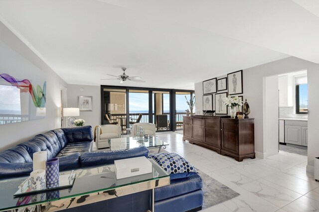 living room with floor to ceiling windows and ceiling fan