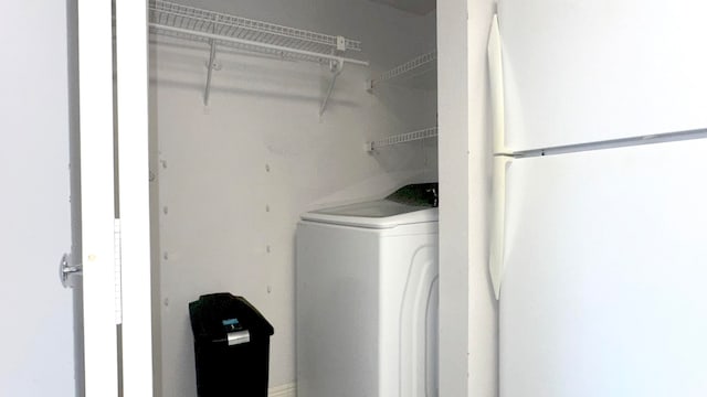 washroom featuring washer / clothes dryer