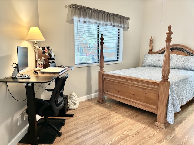 bedroom with light hardwood / wood-style flooring