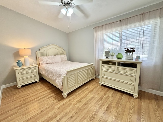 bedroom featuring light wood-type flooring and ceiling fan