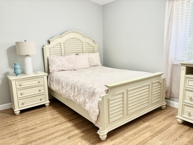 bedroom with light hardwood / wood-style flooring