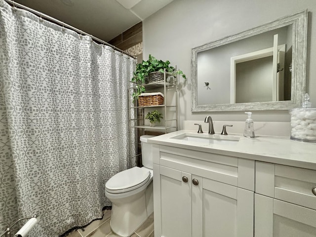 bathroom featuring tile patterned floors, a shower with shower curtain, toilet, and vanity