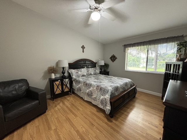 bedroom with light wood-type flooring and ceiling fan