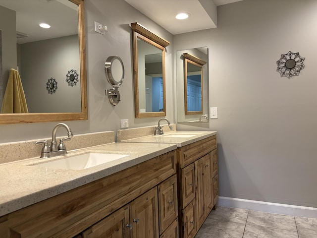 bathroom featuring tile patterned flooring and vanity