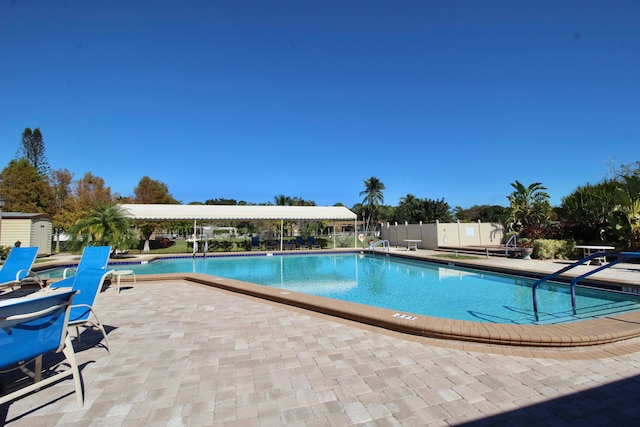 view of swimming pool featuring a patio