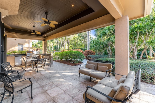 view of patio with ceiling fan, grilling area, and outdoor lounge area