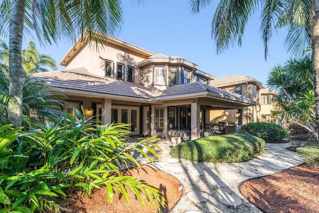 rear view of house featuring a patio area