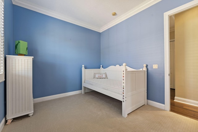 carpeted bedroom featuring ornamental molding