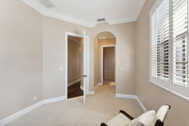 living area with light carpet and ornamental molding