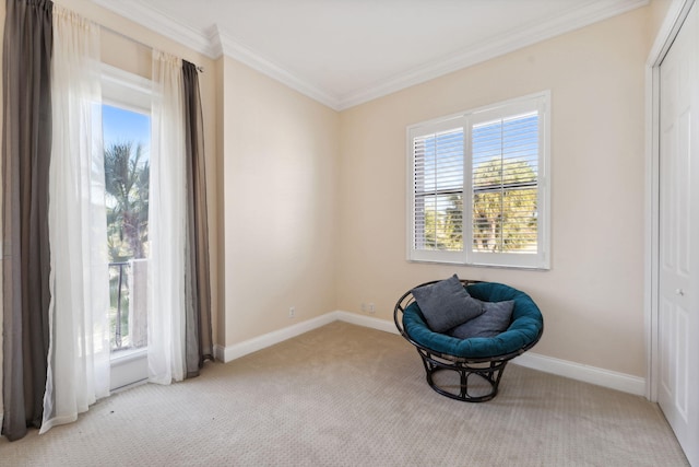 sitting room with light carpet, ornamental molding, and plenty of natural light