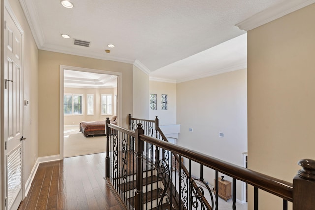 hall featuring crown molding and dark hardwood / wood-style flooring