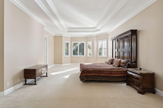 bedroom featuring a raised ceiling, ornamental molding, and light carpet