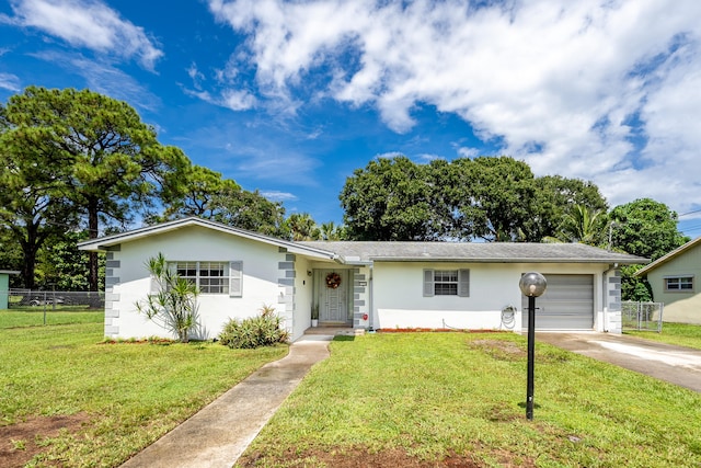 single story home with a garage and a front yard