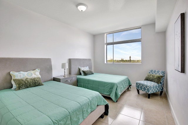 bedroom featuring light tile patterned flooring