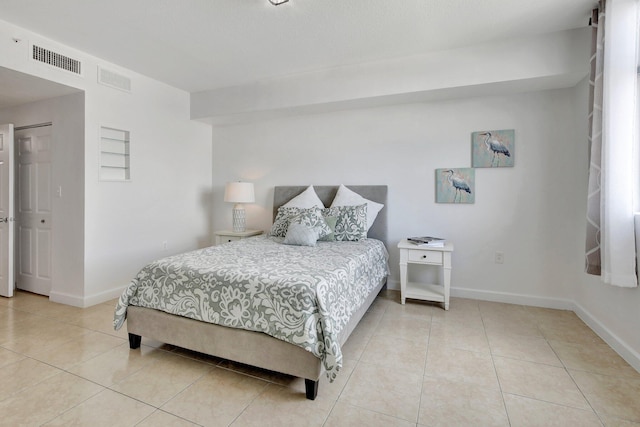 bedroom featuring tile patterned flooring