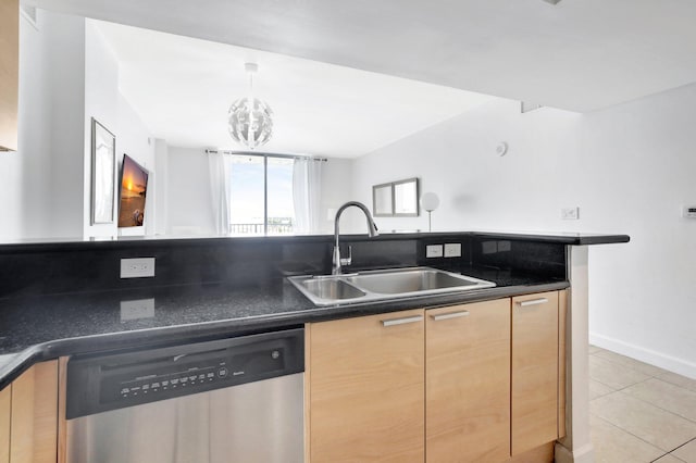 kitchen featuring light brown cabinetry, light tile patterned floors, dishwasher, a chandelier, and sink