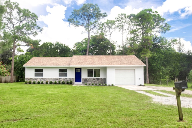 single story home with a garage and a front lawn