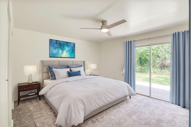 carpeted bedroom with ceiling fan and access to outside