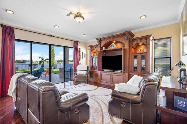 living room with crown molding and dark hardwood / wood-style flooring