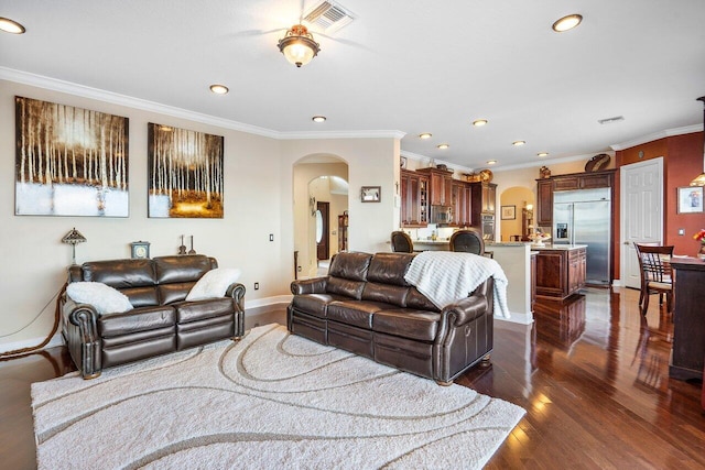 living room with crown molding and dark wood-type flooring