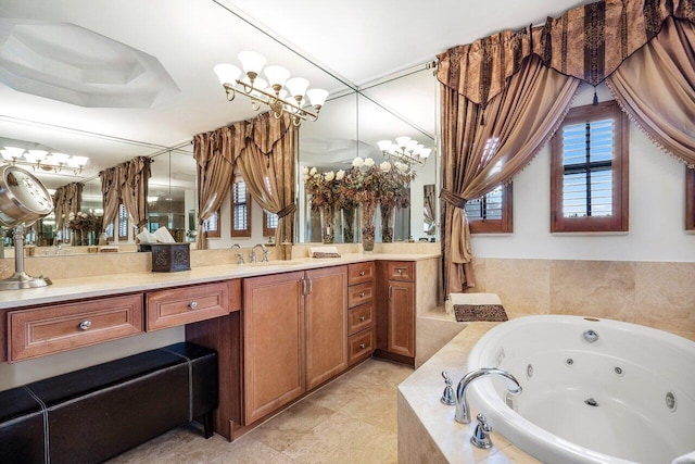 bathroom featuring a tray ceiling, vanity, and a relaxing tiled tub