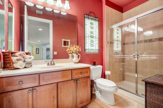 bathroom with a shower with shower door, tile patterned flooring, toilet, and vanity