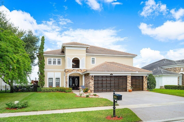 mediterranean / spanish-style home featuring a garage and a front lawn