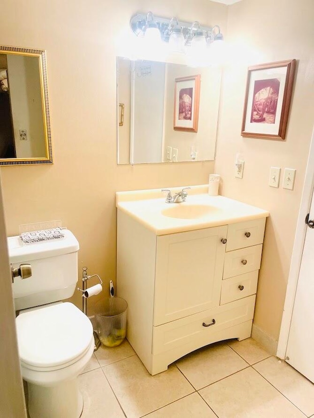 bathroom with tile patterned floors, toilet, and vanity