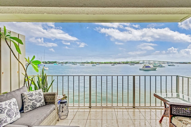 balcony featuring a water view