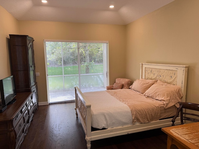 bedroom featuring access to exterior, dark wood-type flooring, and vaulted ceiling