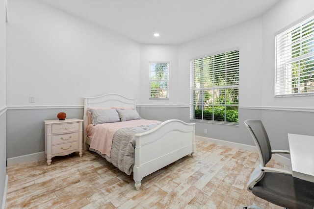 bedroom with light wood-type flooring