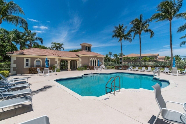 view of swimming pool featuring a patio area