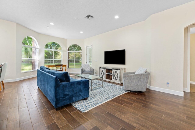 living room with a textured ceiling