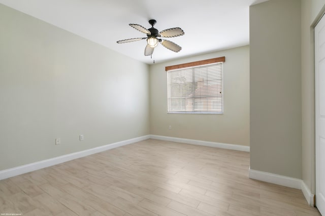 empty room featuring ceiling fan and light hardwood / wood-style floors