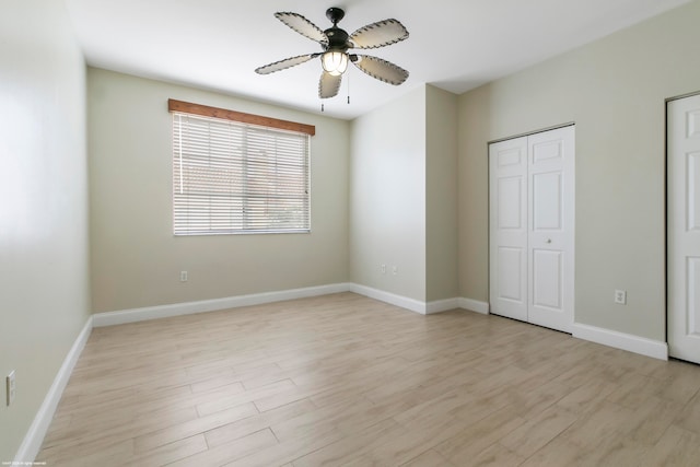 unfurnished bedroom with ceiling fan and light hardwood / wood-style floors