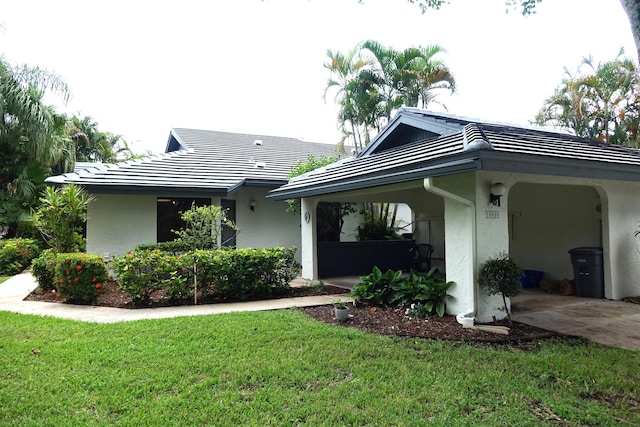 rear view of property featuring a yard