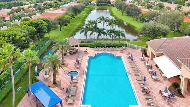 view of swimming pool with a water view