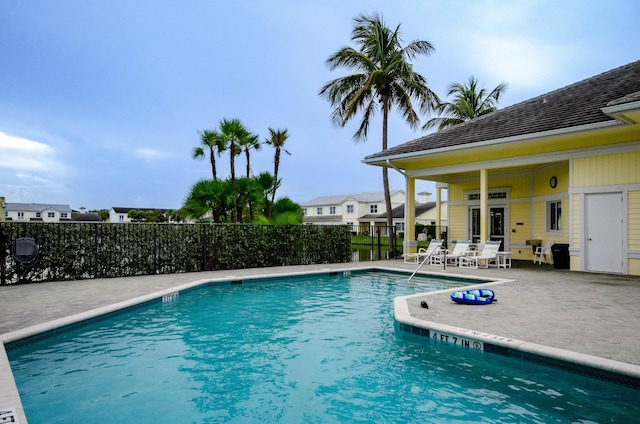 view of swimming pool with a patio area